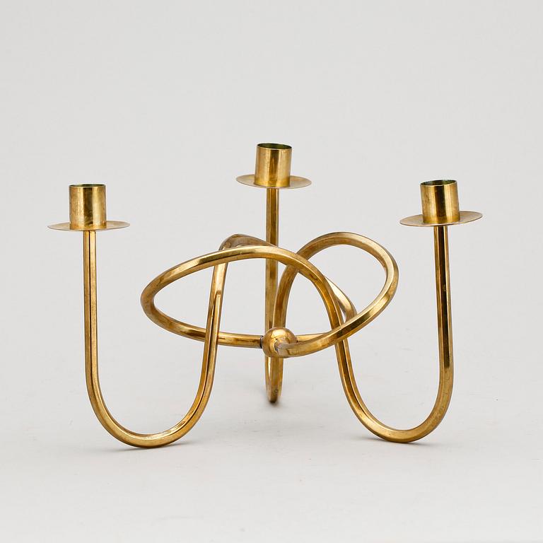 LJUSSTAKE, mässing, "Vänskapsknuten", Josef Frank, Firma Svenskt Tenn, formgiven 1938.