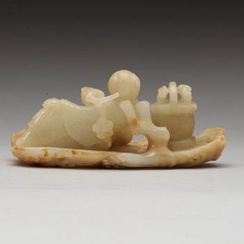 A Chinese nephrite figure of a lady with a flower basket, qing dynasty (1644-1912).