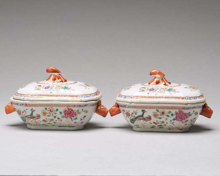 A pair of famille rose 'double peacock' butter tureens with covers and stands, Qing dynasty, Qianlong (1736-95).