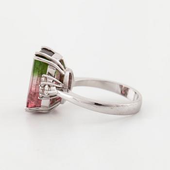 A emerald cut tourmaline and brilliant cut diamond ring.