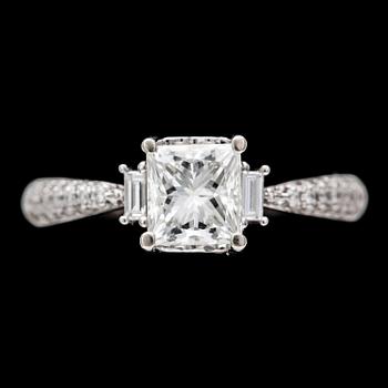 62. RING, princess cut diamond, app. 1 ct, and smaller diamonds.