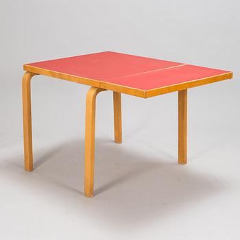 Alvar Aalto, a mid 20th century 'DL85' folding table, seven chairs for Artek.