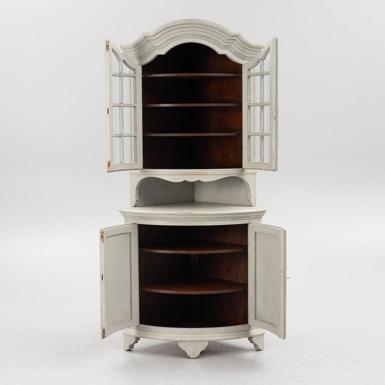 A Gustavian style 20th century corner cabinet.