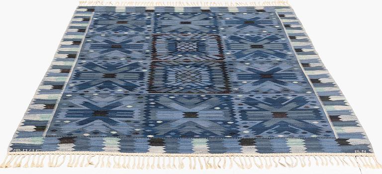 Barbro Nilsson, a carpet, "Nejlikan blå", flat weave, ca 275 x 218 cm, signed AB MMF BN.