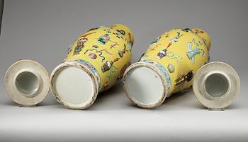 A pair of yellow-ground jars with covers, Qing dynasty.