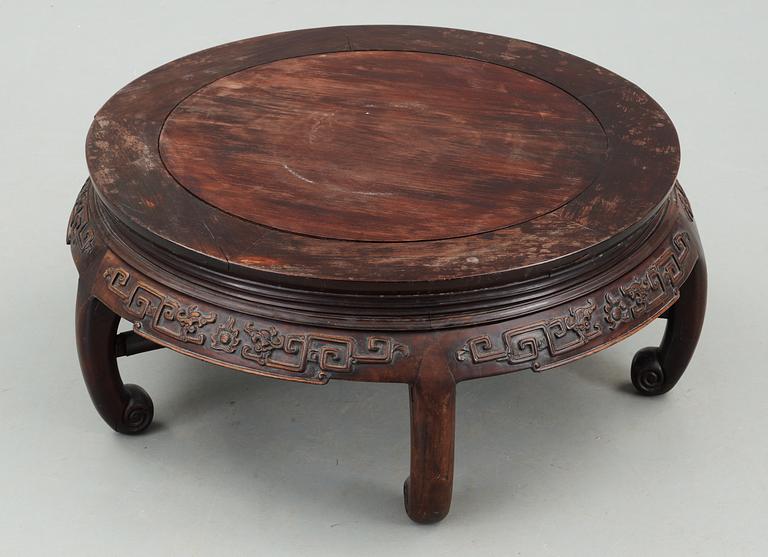 A round hardwood table, Qing dynasty.