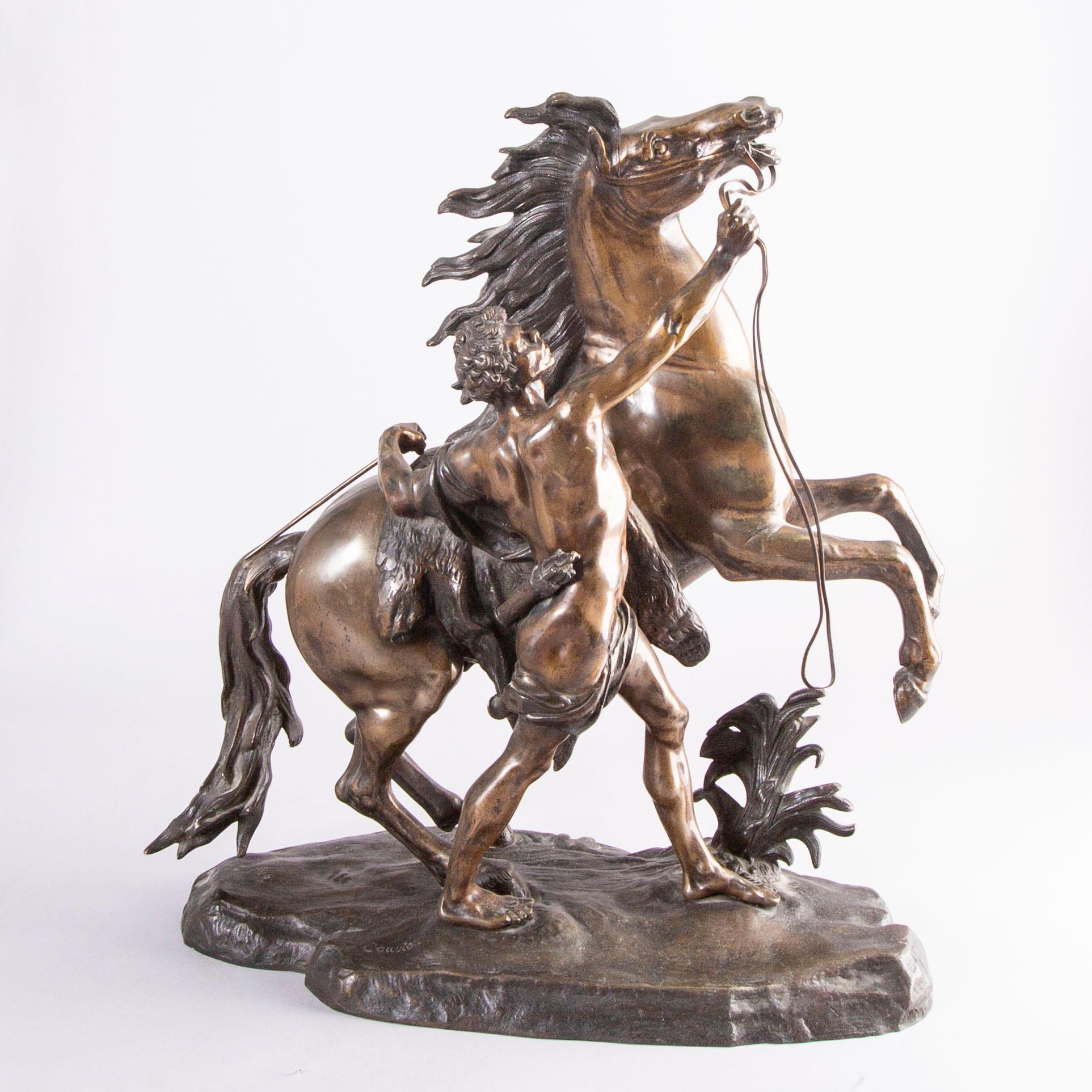 Guilliaume Coustou, after, a signed bronze sculpture  "Chevaux de Marly" from the second part of the 1800's.