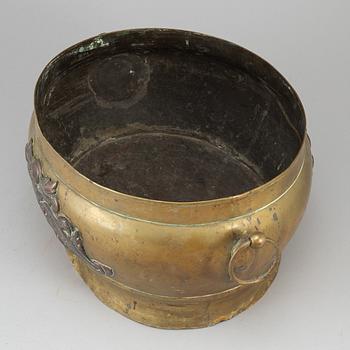 A 17th century brass and copper champagne cooler.