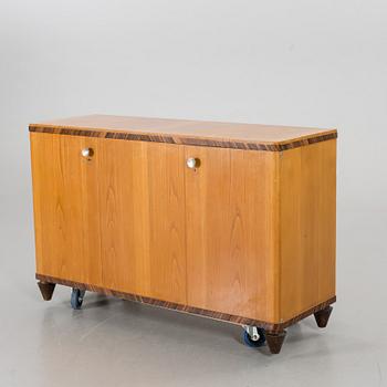 A "MODEL OK" SIDEBOARD DESIGNED BY AXEL EINAR HJORTH FOR NORDISKA KOMPANIET.