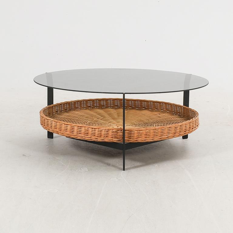 A late 20th century glas, metal and wicker coffee table.