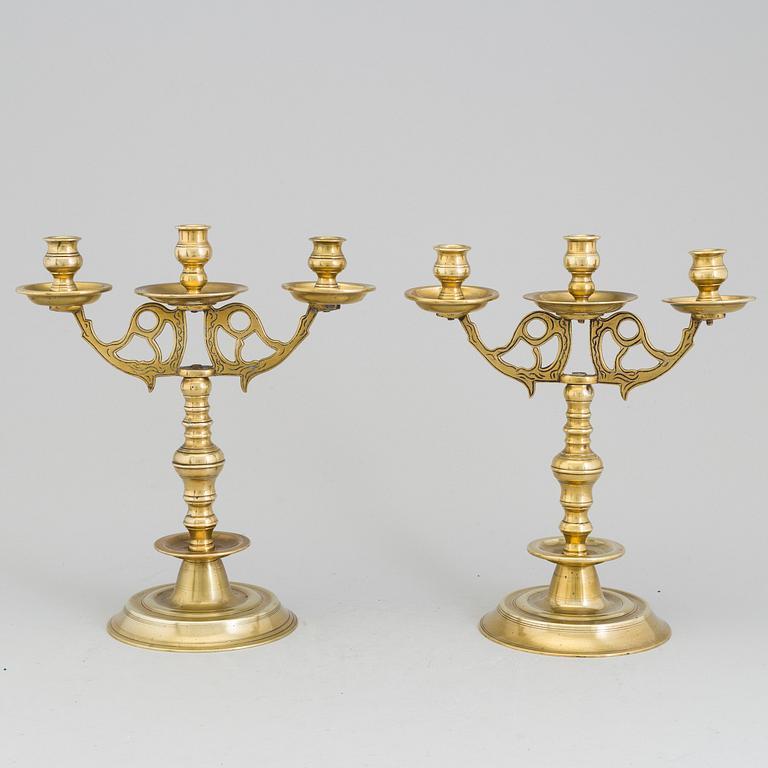 A apir of brass Baroque style candelabra, circa 1900.