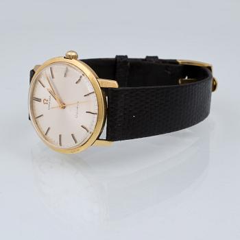 ARMBANDSUR, herr, 18 k guld, "Genève", Omega, total vikt 32 g.