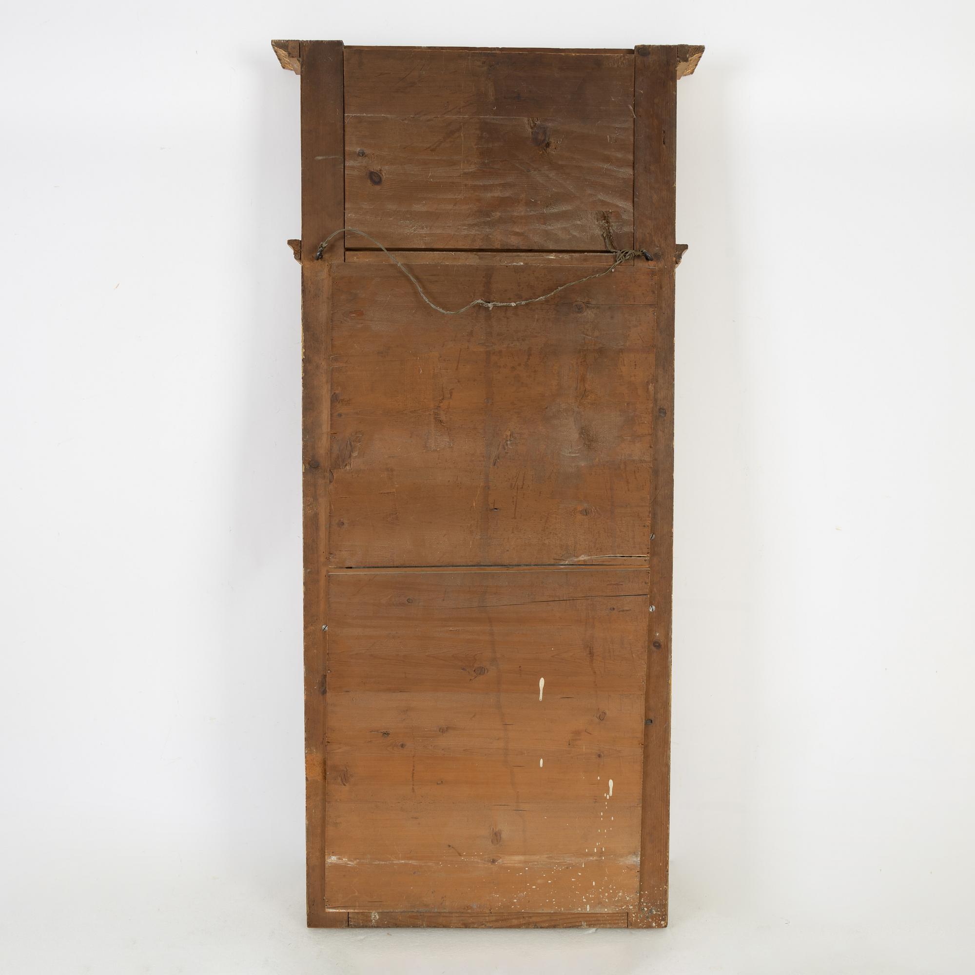 An Empire mirror, first half of the 19th Century.