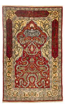 358. A silk and metal Hereke rug, c. 86 x 52 cm.