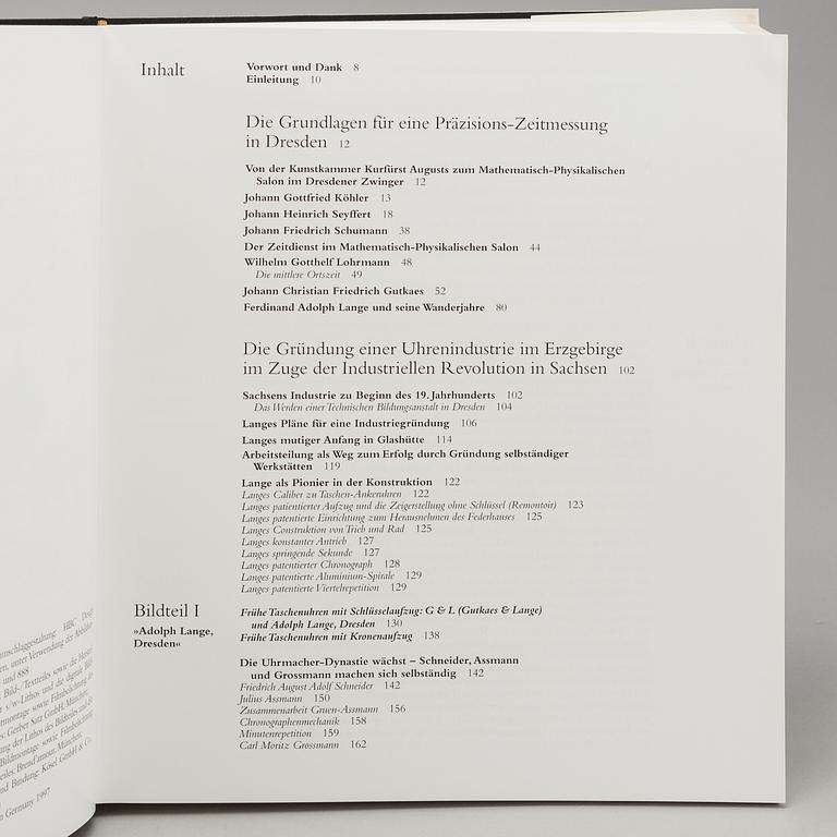 A set of 5 watch books.