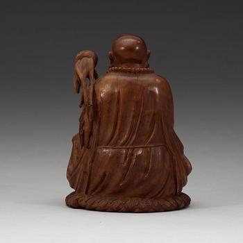 A Chinese wooden figure of a daoist dignitary.