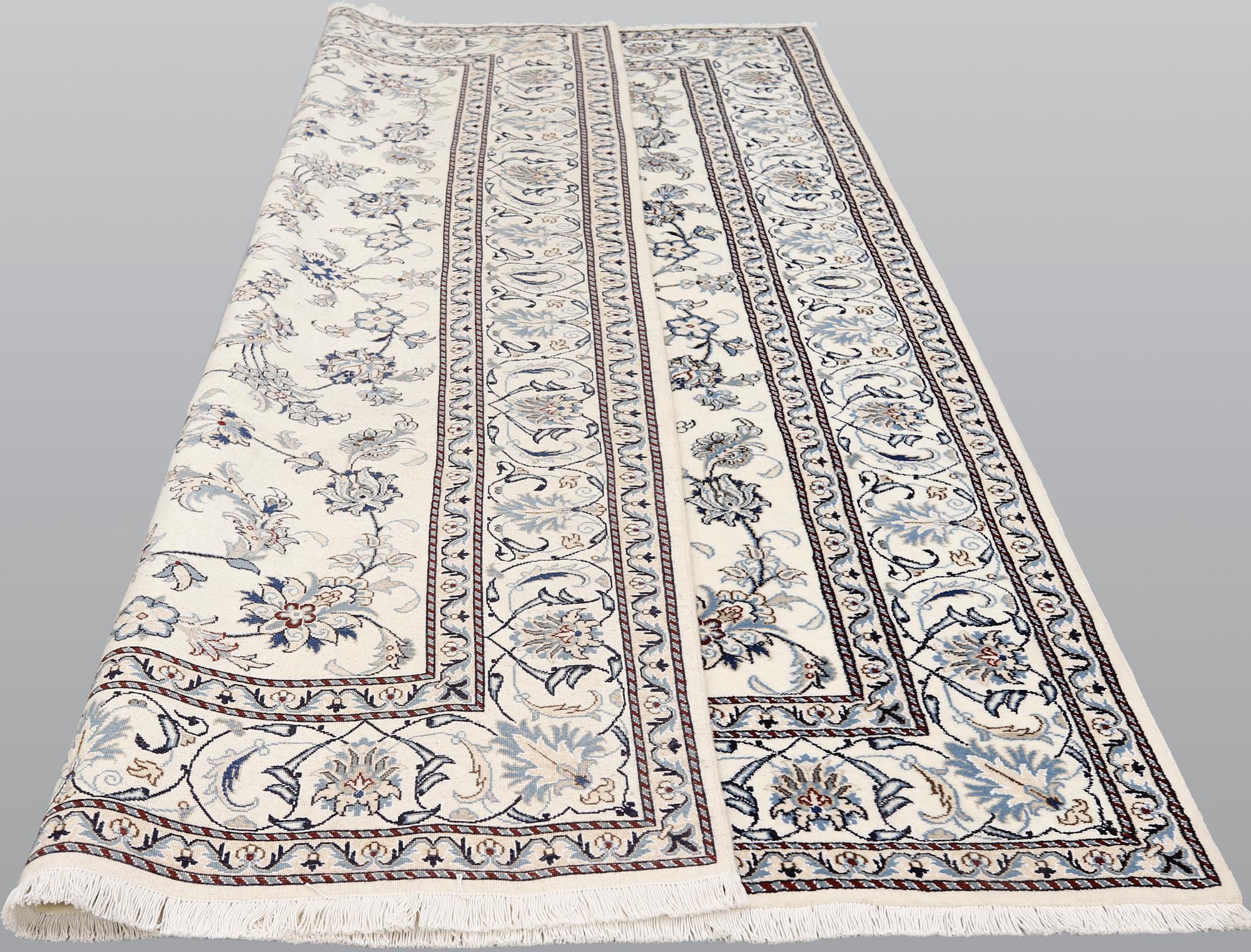 A part silk Nain carpet, ca 305 x 198 cm.