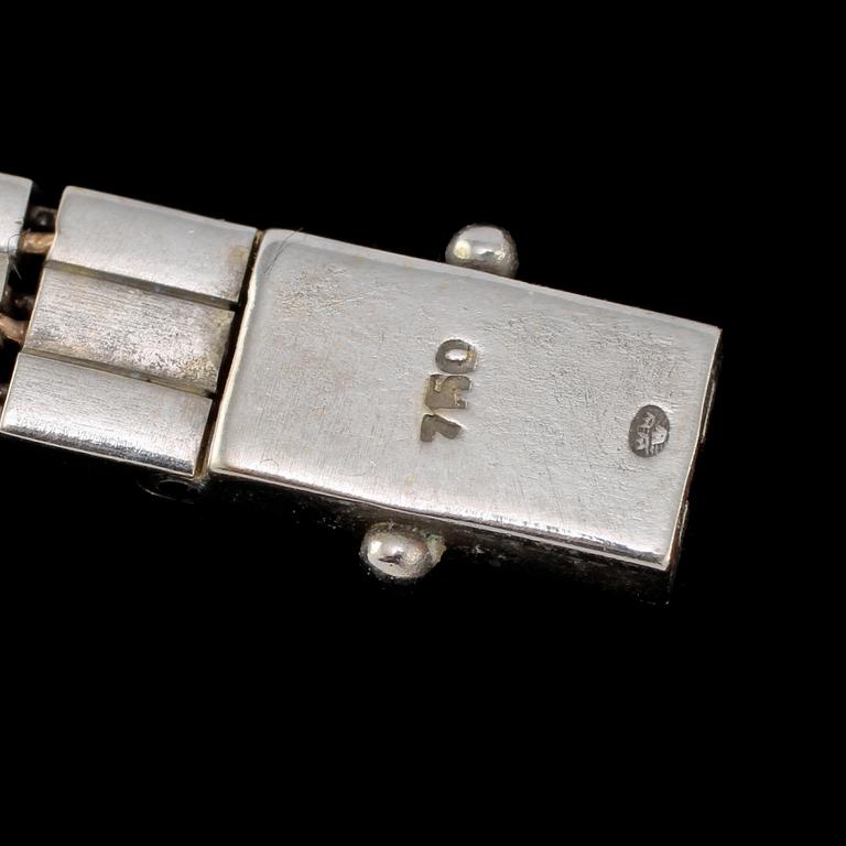 ARMLÄNK, 18k guld med 12 åttkantslipade diamanter, importstämplat, 1900-talets tredje kvartal. Vikt 21 g.