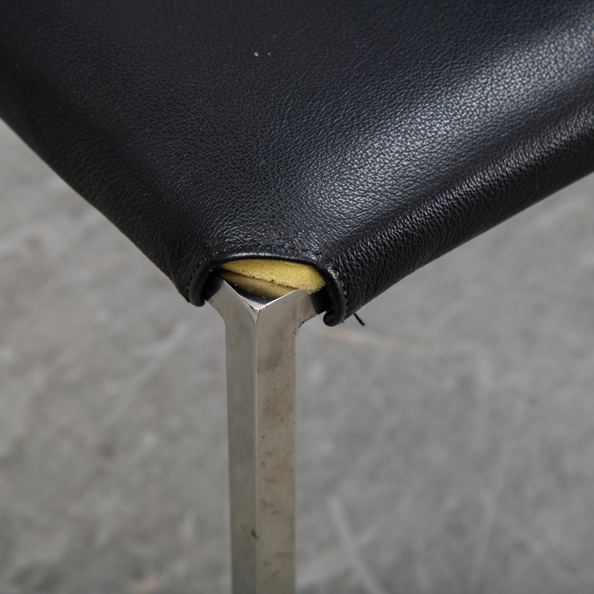 A set of eight steel and leather chairs, 21th century.