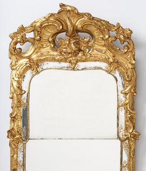 A giltwood rococo mirror, Stockholm, later part 18th century.