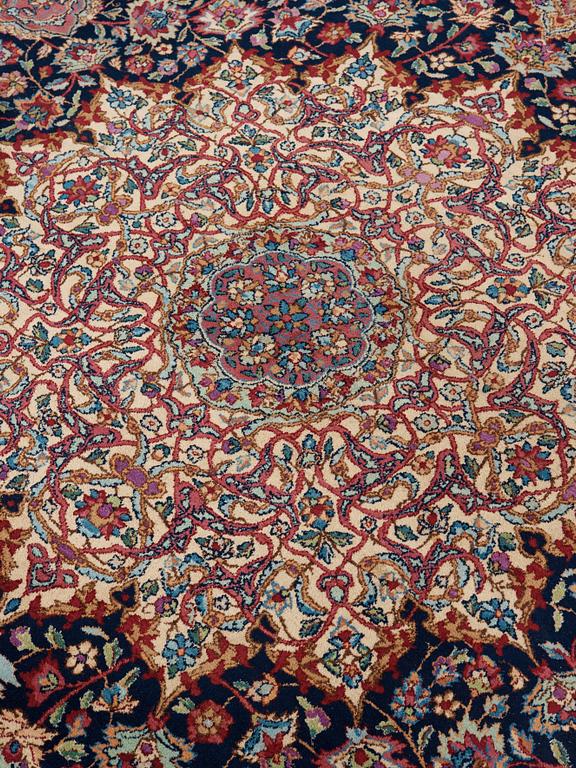 A CARPET. A semi-antique Kerman. 614,5 x 360,5 cm.