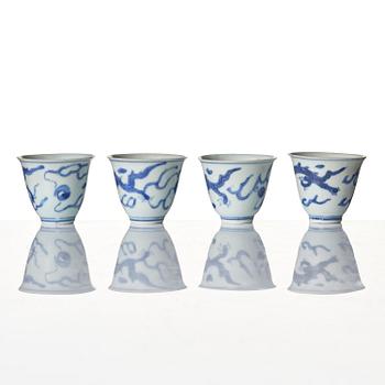 A set of four blue and white dragon wine cups, 'Hatcher Cargo', 17th century.