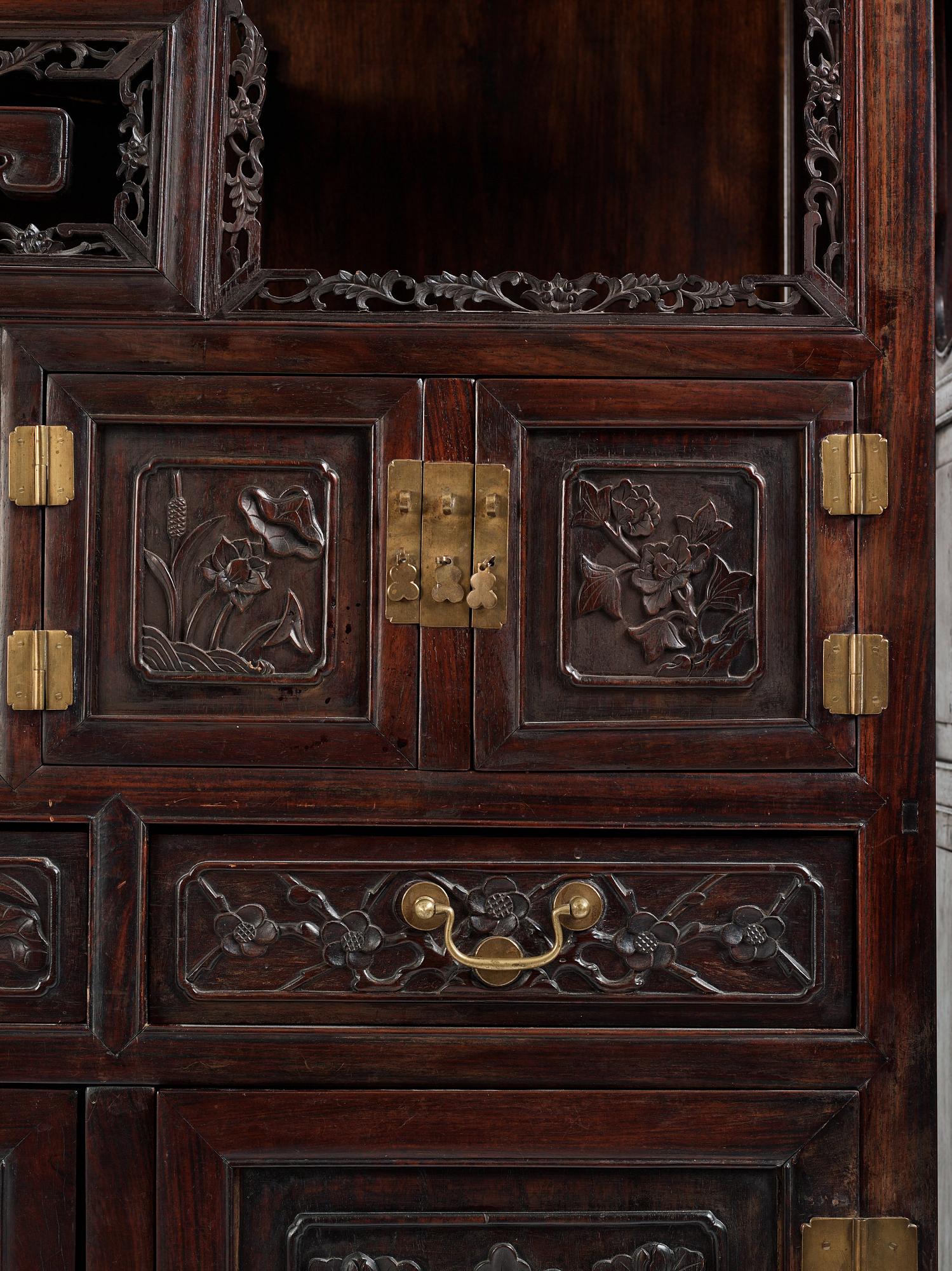 A pair of Chinese hardwood display cabinets, Qing dynasty, 19th Century.