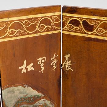 A Chinese six panel wooden folding screen, first half of the 20th Century.