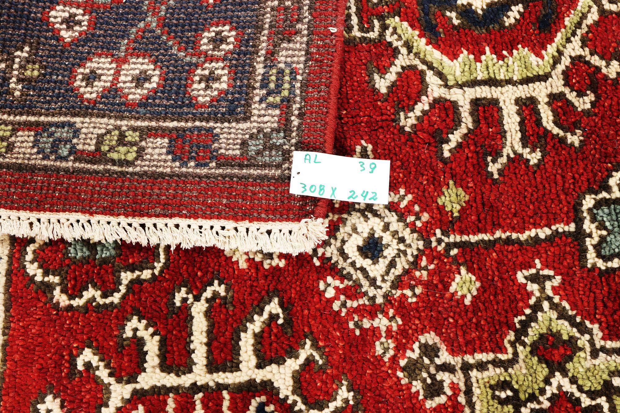 A carpet, Mamluk design, c. 308 x 242 cm.