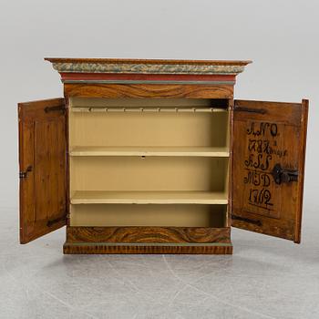 A 18/19th Century painted cabinet.