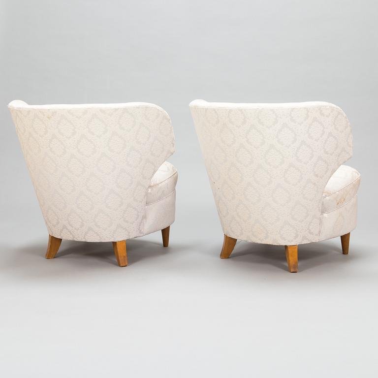A pair of 1950's armchairs.