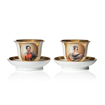 A pair of late Empire Chocolate cups with stands, 19th Century, one signed by Wilhelm Heinemann, Stockholm.