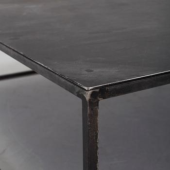 A modern square metal sofa table.