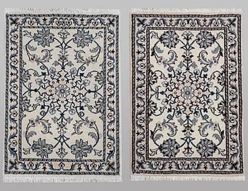 A pair of rugs, Nain, part silk, ca 90 x 60 cm & ca 90 x 60 cm.