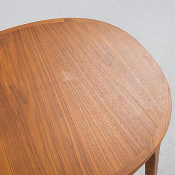 A teak-veneered dining table, second half of the 20th century.