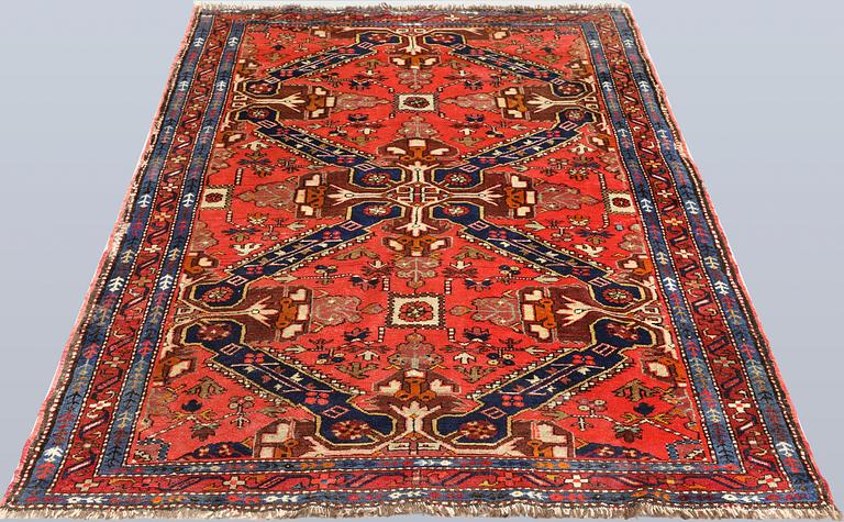 A Caucasian semi-antique rug, c. 200 x 128 cm.