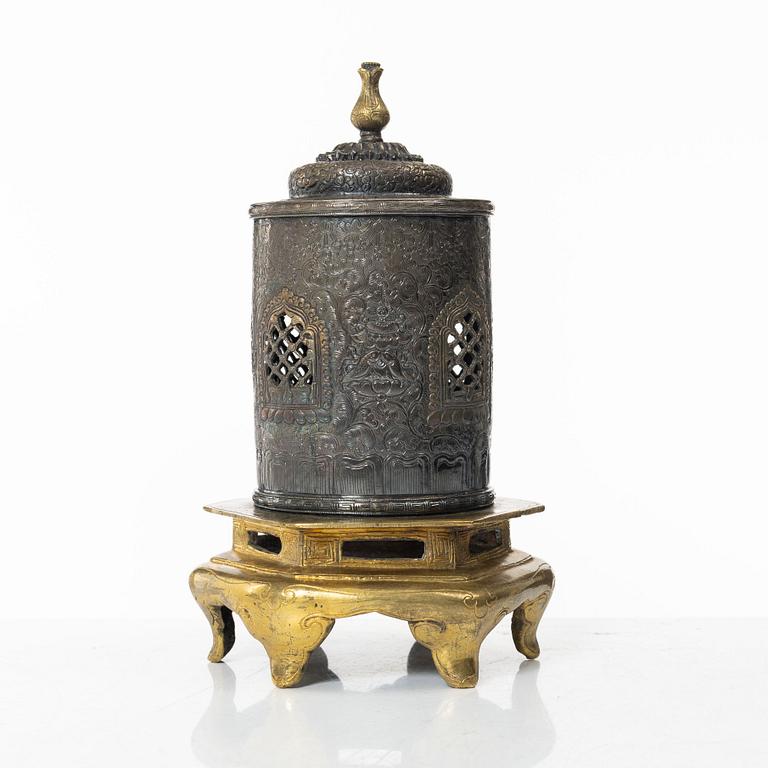 A silvered brass prayer container, Tibet, 20th century.