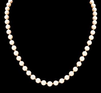 A necklace of cultured pearls, clasp of 18K gold, cabochon cut aquamarine and seed pearls, Atelier Ajour Stockholm 1963.