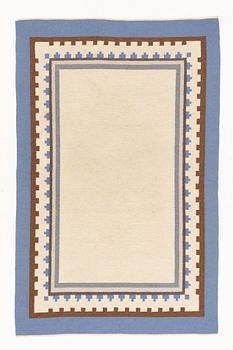 A flat weave rug, c. 304 x 197 cm.