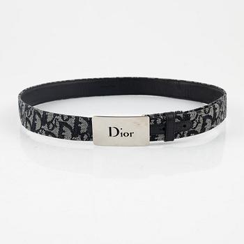 Christian Dior, two unbreallas and a belt.