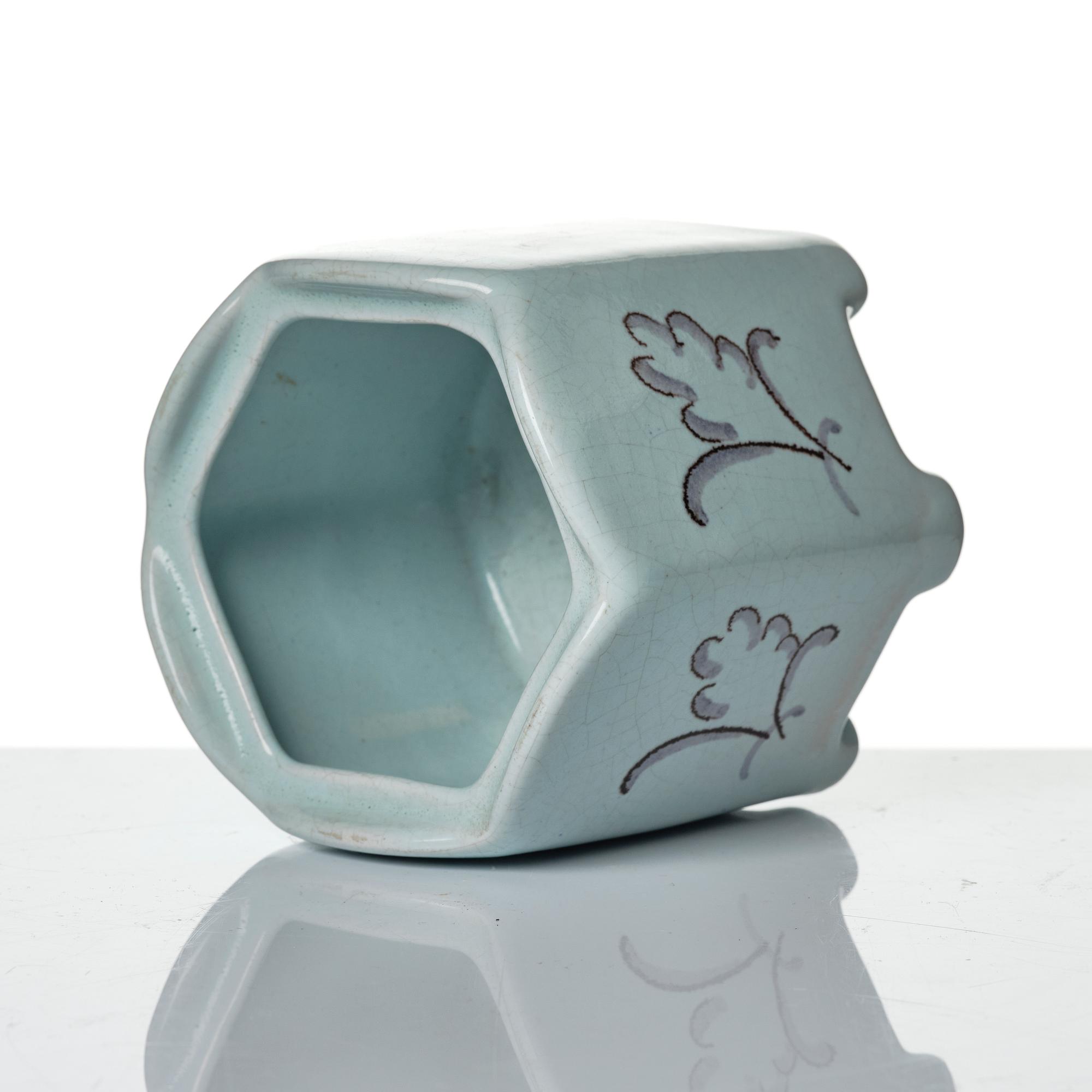Wilhelm Kåge, eleven pieces of faience including jars, inkwells and a tulip vase, Gustavsberg, Sweden, 1919-1920.