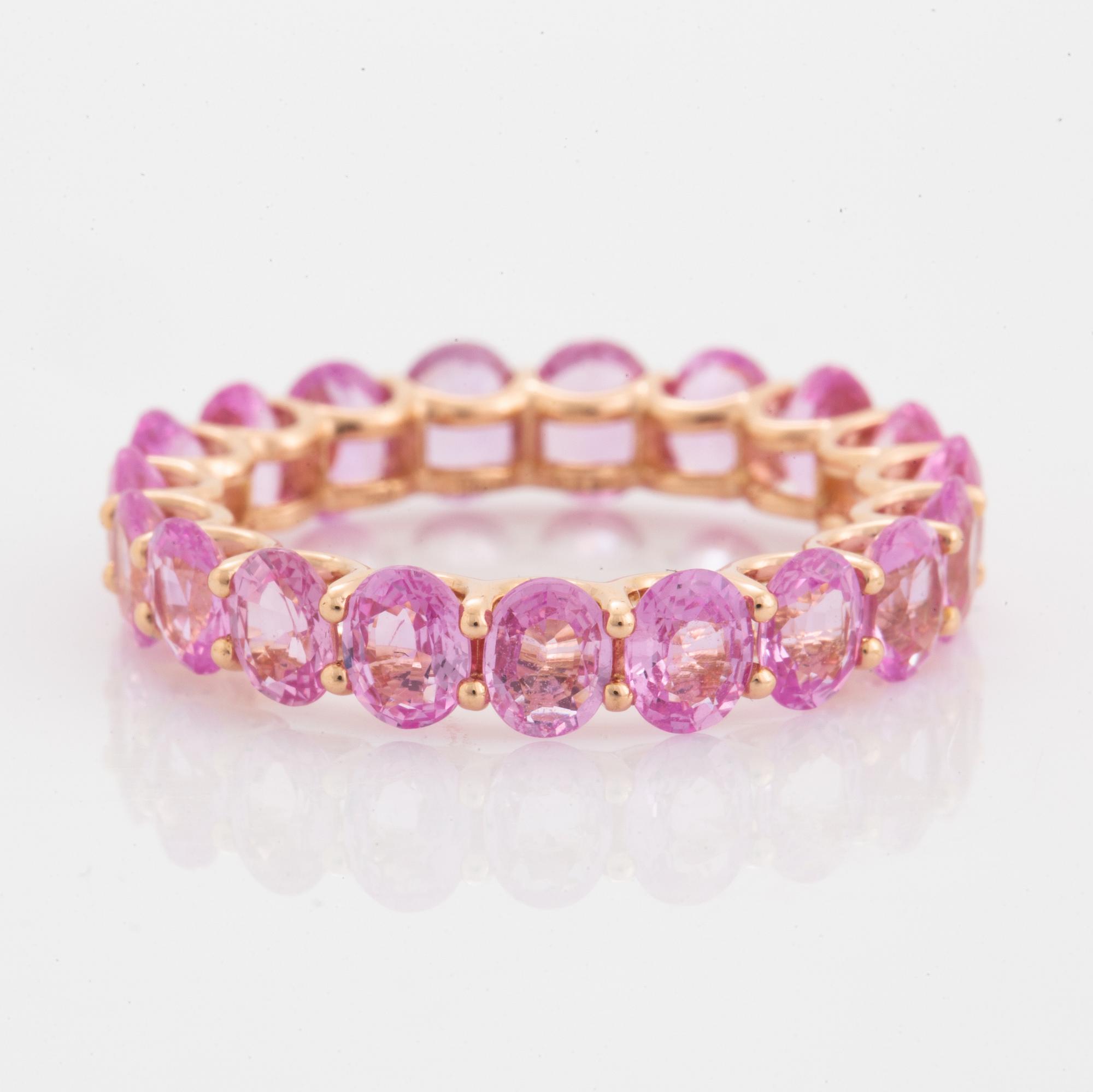 Oval faceted pink sapphire ring.