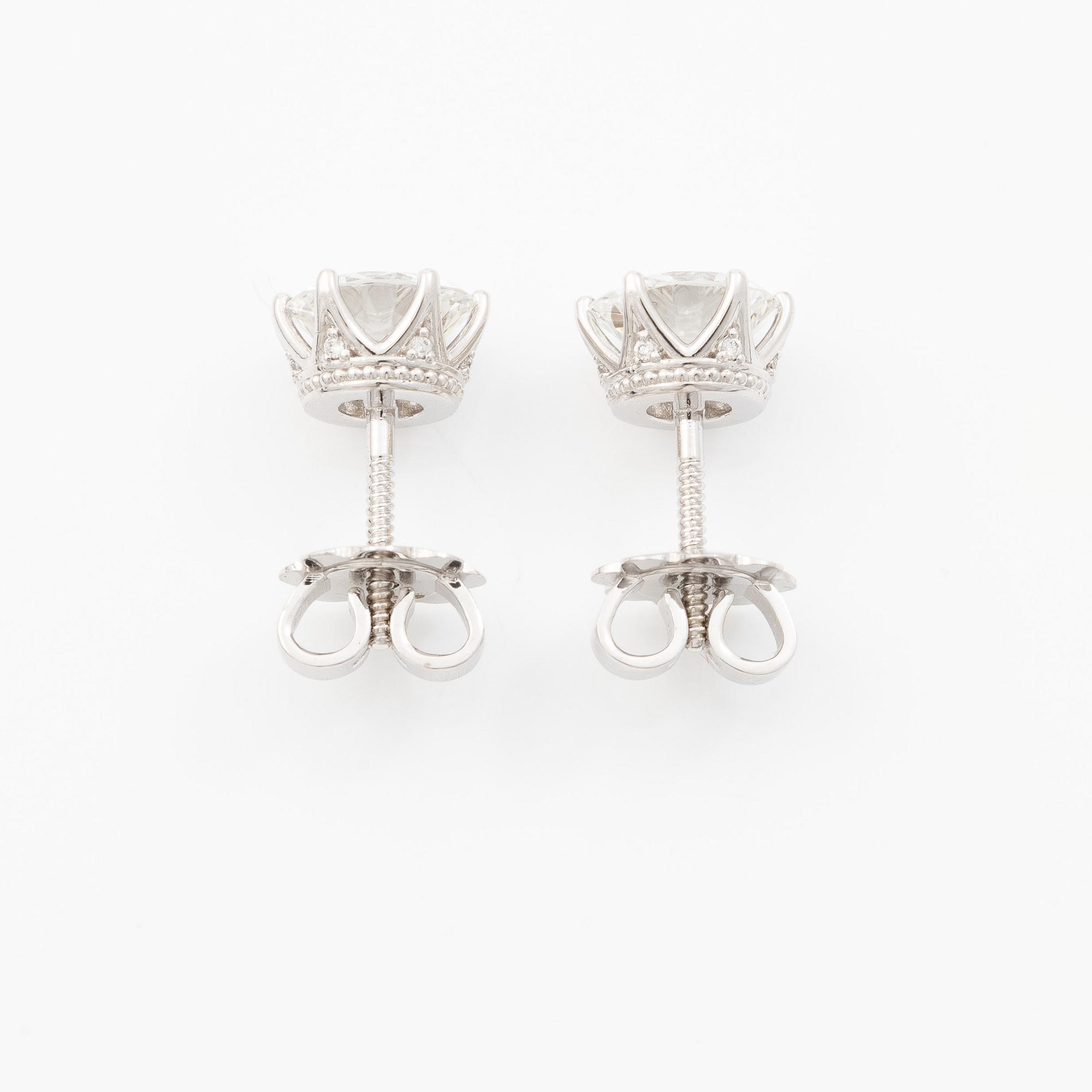 Earrings, single-stone earrings in 18K white gold with brilliant-cut diamonds, accompanied by IGI report.