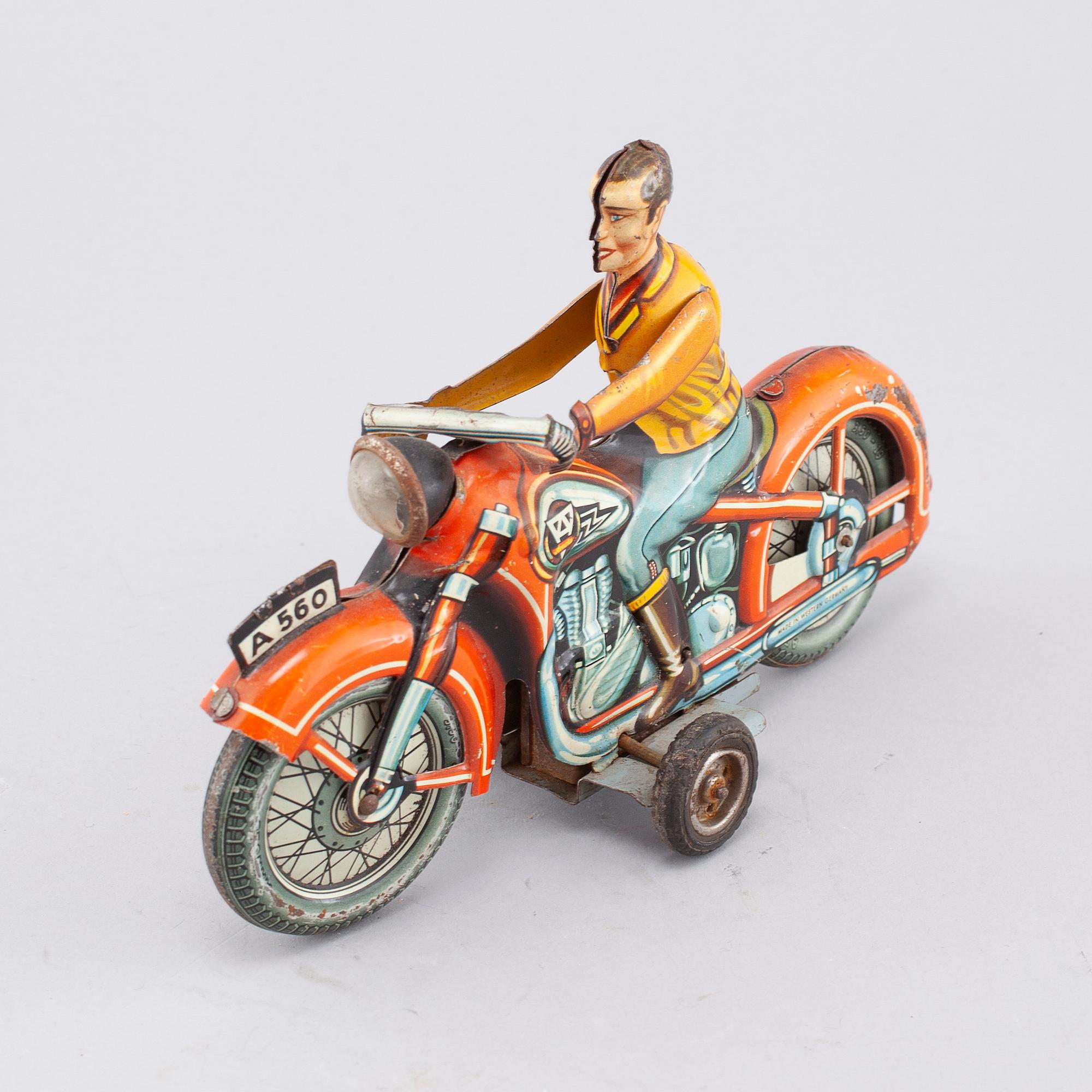 A mid 20th century "Arnold" tin toy.