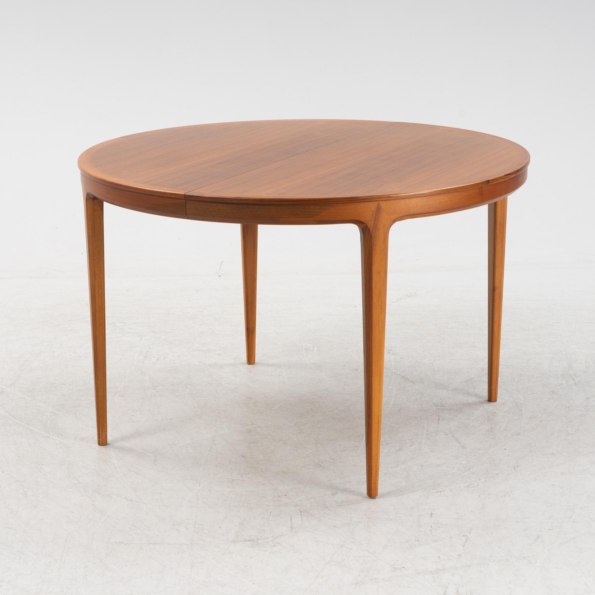 A 'Diamant' walnut dining table by Bertil Fridhagen, for Bodafors, 1960s.