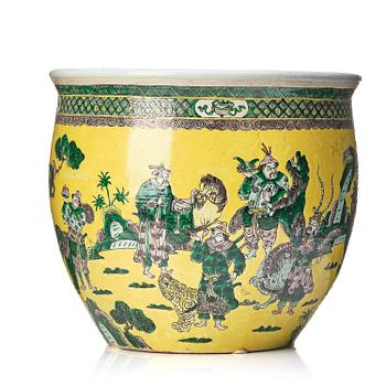 1279. A large yellow ground famille verte bisquit jardiniere, Qing dynasty, 19th century. Marked 'Tack Loong Canton China'.
