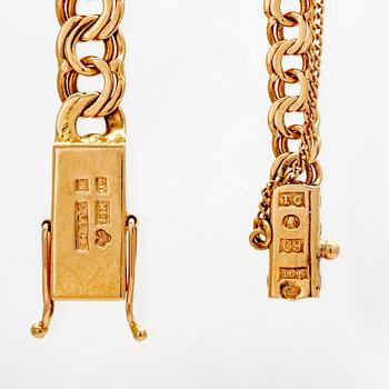 Armlänkar, 2 st. 18K guld, bismarck.
