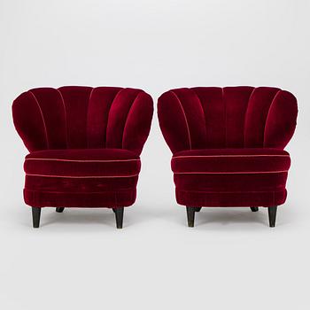 A pair of mid-20th century armchairs.