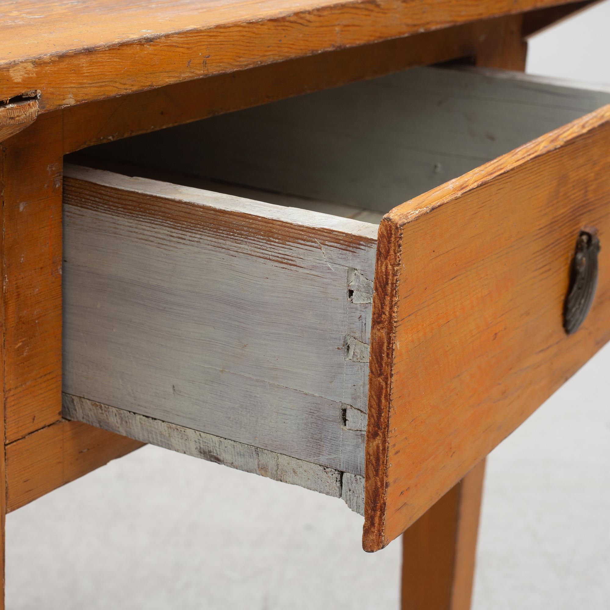 A table with drawer, 19th century.