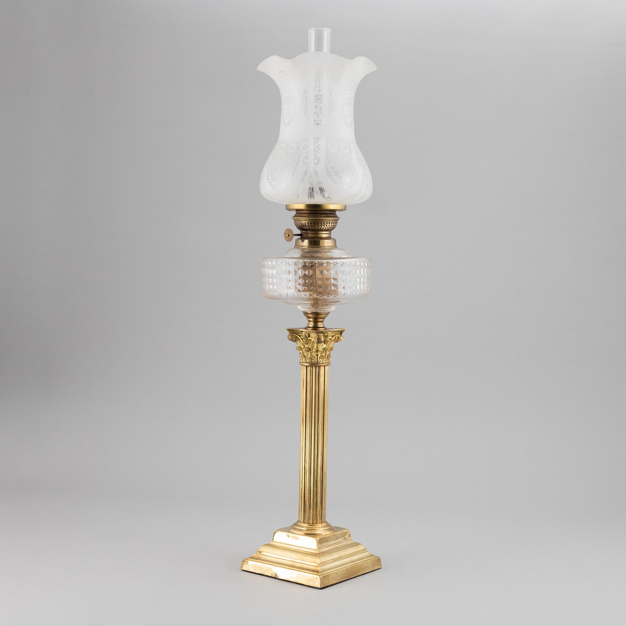 A brass oil lamp, ca 1900.